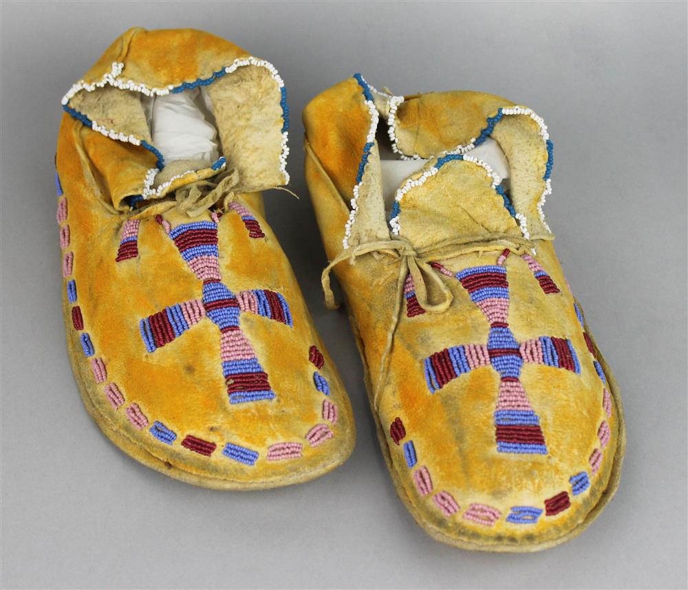 Appraisal: PAIR OF PLAINS BEADED AND PIGMENTED HIDE MOCCASINS old printed