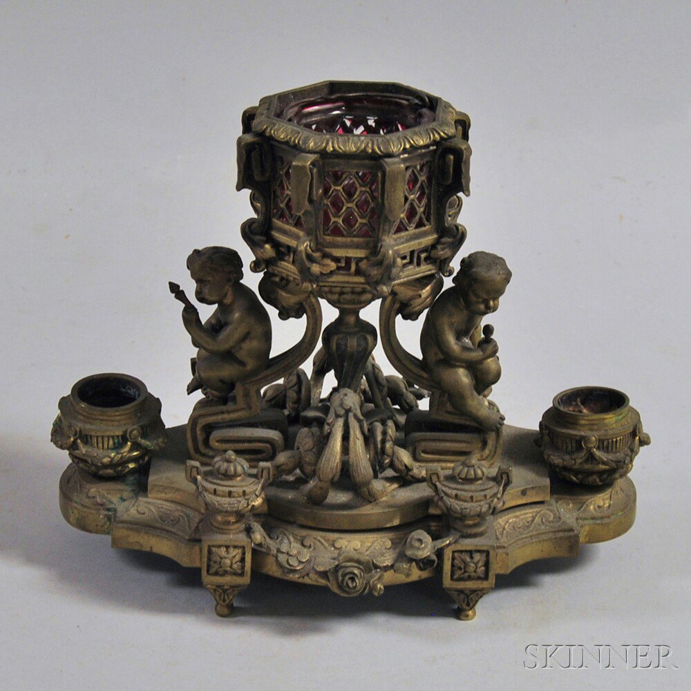 Appraisal: Figural Bronze Decorative Candleholder th century with two cherubs on