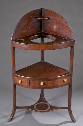 Appraisal: Regency mahogany corner wash stand A Regency style mahogany corner