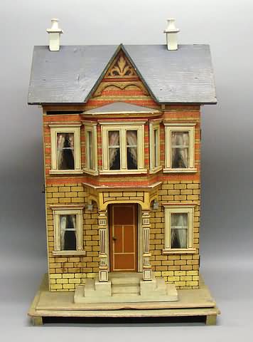 Appraisal: Furnished Bliss style dollhouse Unmarked two story lithographed wooden dollhouse