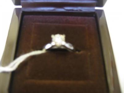 Appraisal: A SOLITAIRE DIAMOND RING the brilliant cut stone of approximately