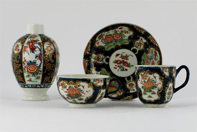 Appraisal: A Worcester trio painted with panels of Oriental flowers in