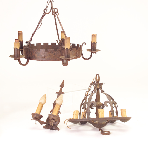 Appraisal: Two unmatched Gothic-style iron chandeliers each with five electric candles