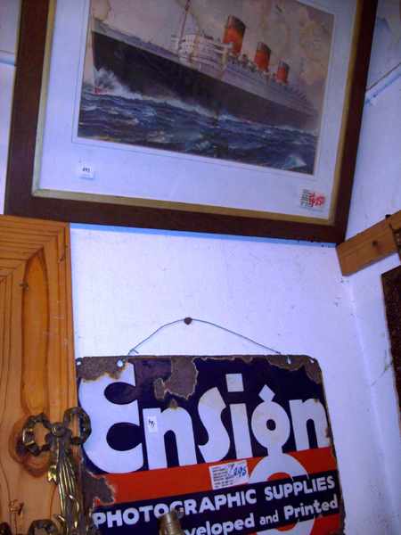 Appraisal: A FRAMED SHIP PRINT AND AN 'ENSIGN' ENAMEL SIGN