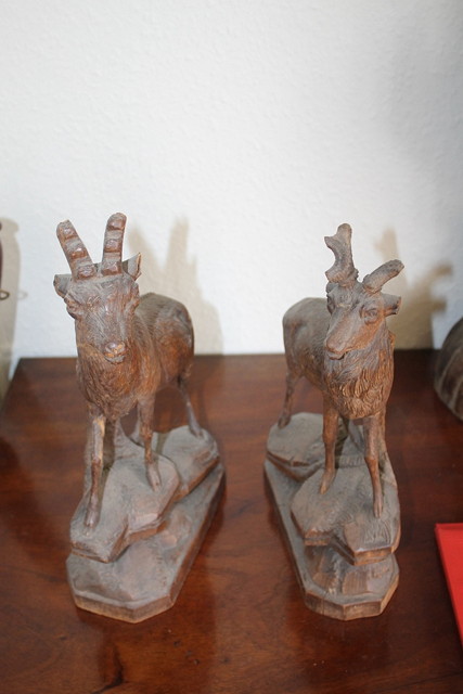 Appraisal: A PAIR OF BLACK FOREST CARVED STANDING MODEL OF STAGS