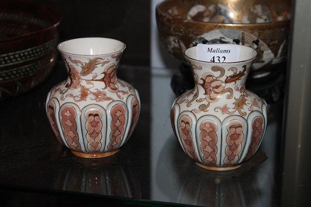 Appraisal: A PAIR OF ZSOLNAY SMALL IVORY GROUND VASES each with