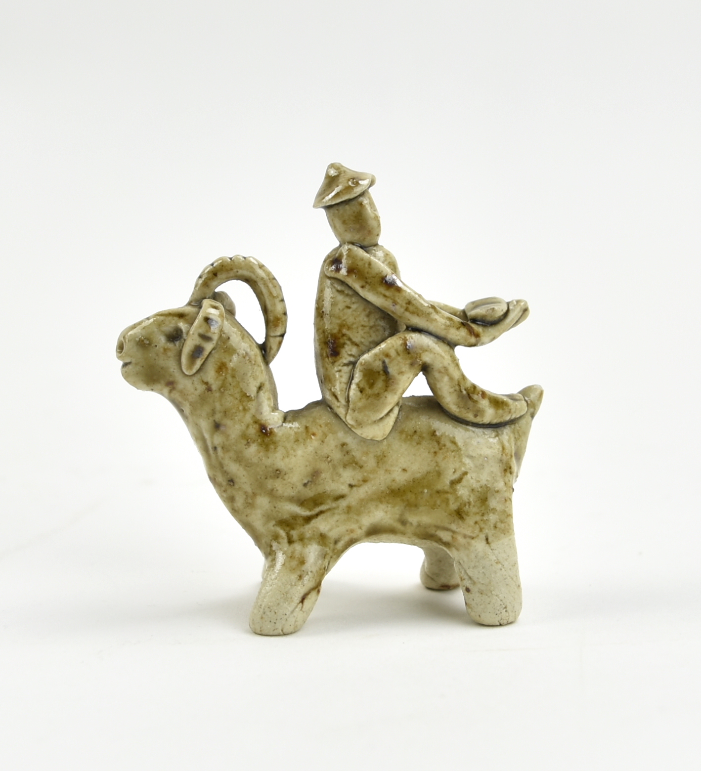 Appraisal: Chinese Jin Dynasty a celadon glazed ornament with a figure