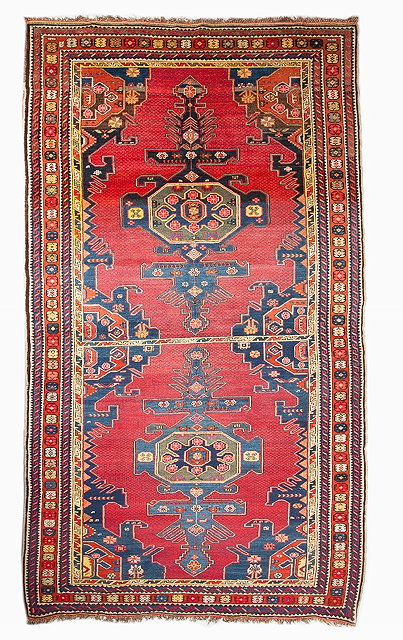 Appraisal: A CAUCASIAN DERBEND HALL CARPET with polychrome double medallion motif