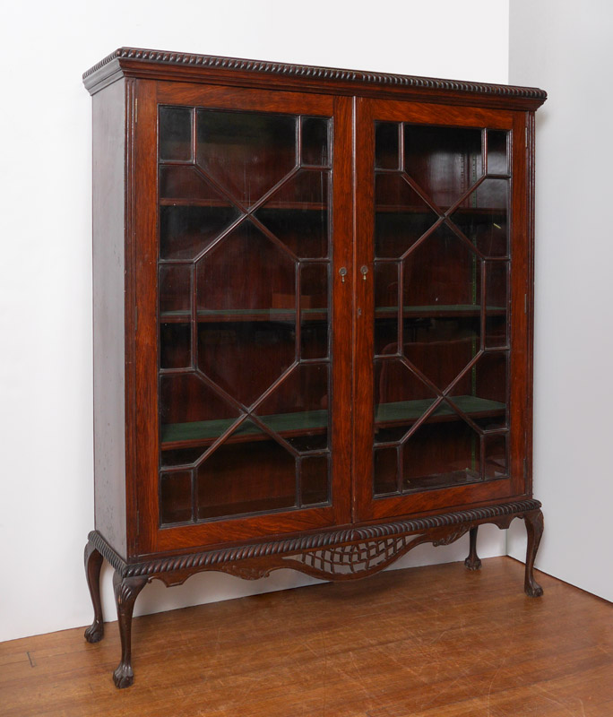 Appraisal: ENGLISH CHIPPENDALE STYLE MAHOGANY BOOKCASE glass front doors with fretwork