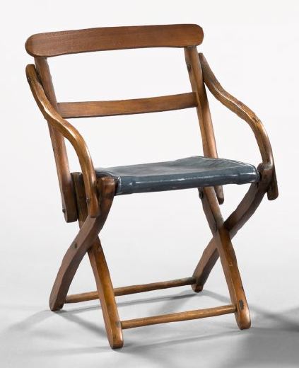 Appraisal: Continental Walnut Miniature Folding Campaign Chair with a leather seat