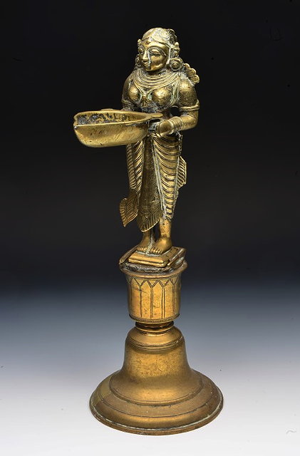 Appraisal: AN ANTIQUE INDIAN HEAVY GILT BRONZE FIGURE of a female