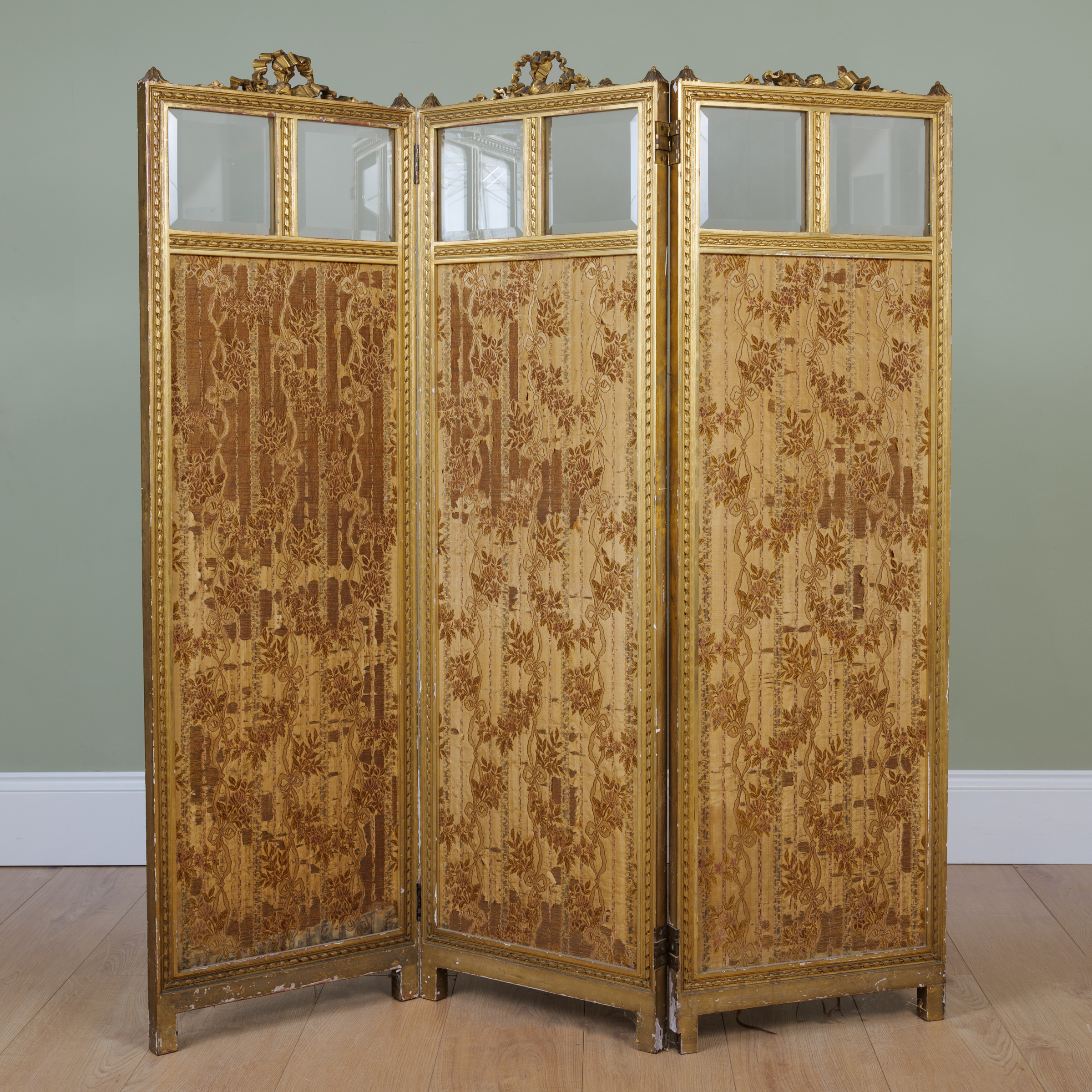 Appraisal: A late th century gilt wood three-fold screen each section