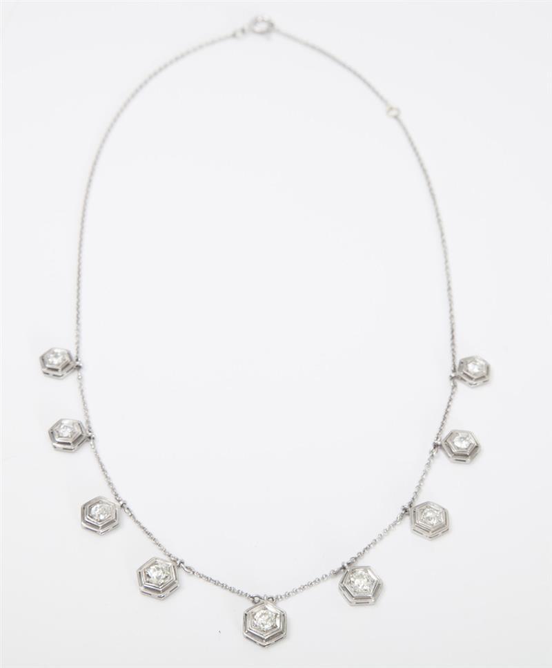 Appraisal: PLATINUM AND DIAMOND PENDANT NECKLACE The slim chain with geometric