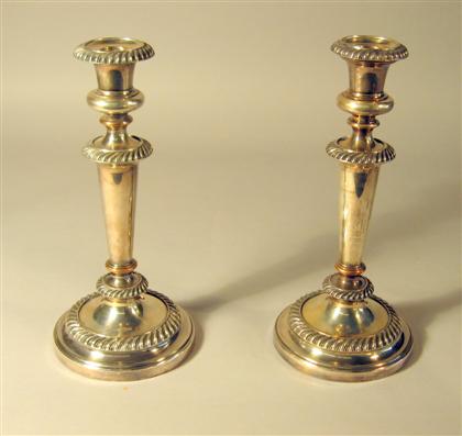 Appraisal: Pair of old Sheffield plate candlesticks early th century Each