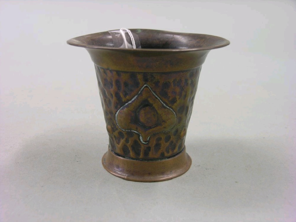 Appraisal: An Art Nouveau embossed copper vase stylised motifs against a