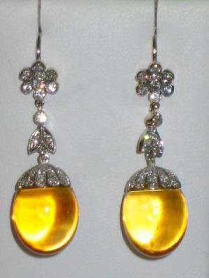 Appraisal: A PAIR OF DIAMOND AND CITRINE EARRINGS the ovoid cabochon