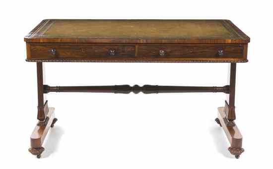 Appraisal: A Regency Rosewood Desk having a rectangular tooled leather inset