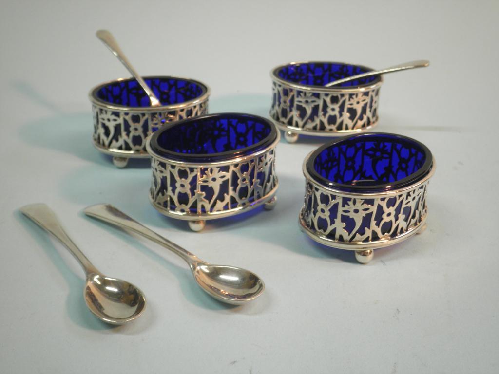 Appraisal: A set of four pierced oval silver salts each with