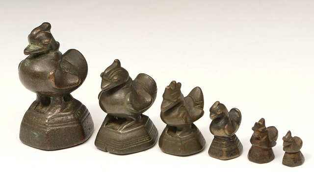 Appraisal: A SET OF SIX GRADUATED BURMESE BRONZE OPIUM WEIGHTS each