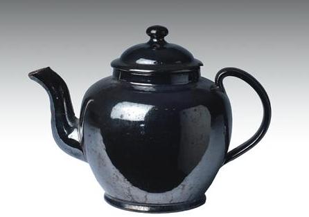 Appraisal: BLACK-GLAZED REDWARE TEAPOT AND COVER EARLY NINETEENTH CENTURY Of spherical