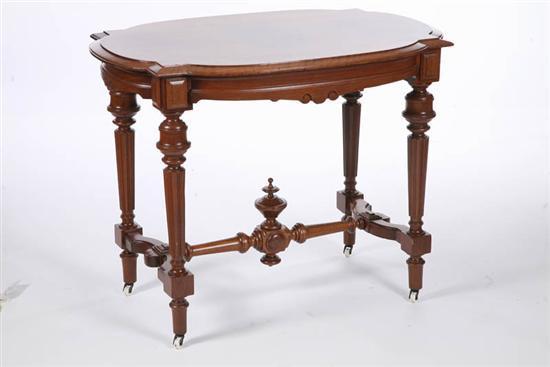 Appraisal: VICTORIAN PARLOR TABLE Walnut with a turtle shaped top over