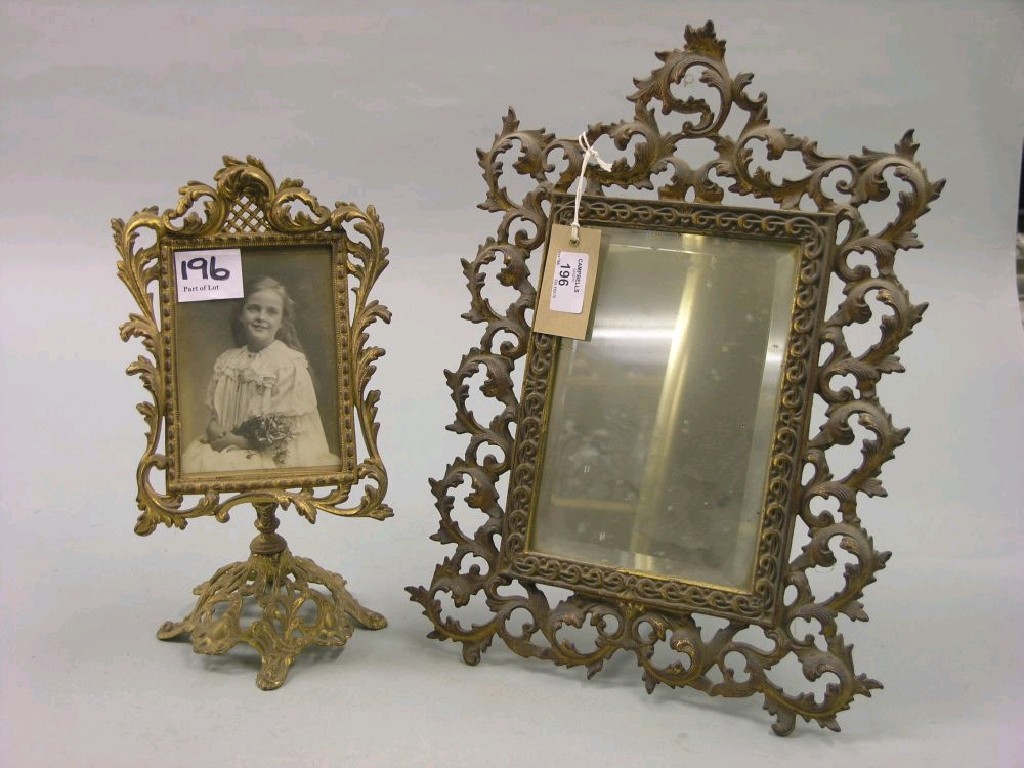 Appraisal: A th century gilt-brass dressing mirror with folding strut support