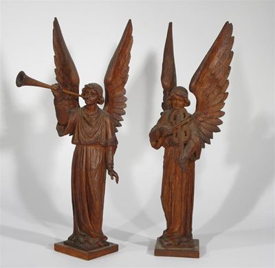 Appraisal: A pair of Arts and Crafts oak angel musicians unsigned