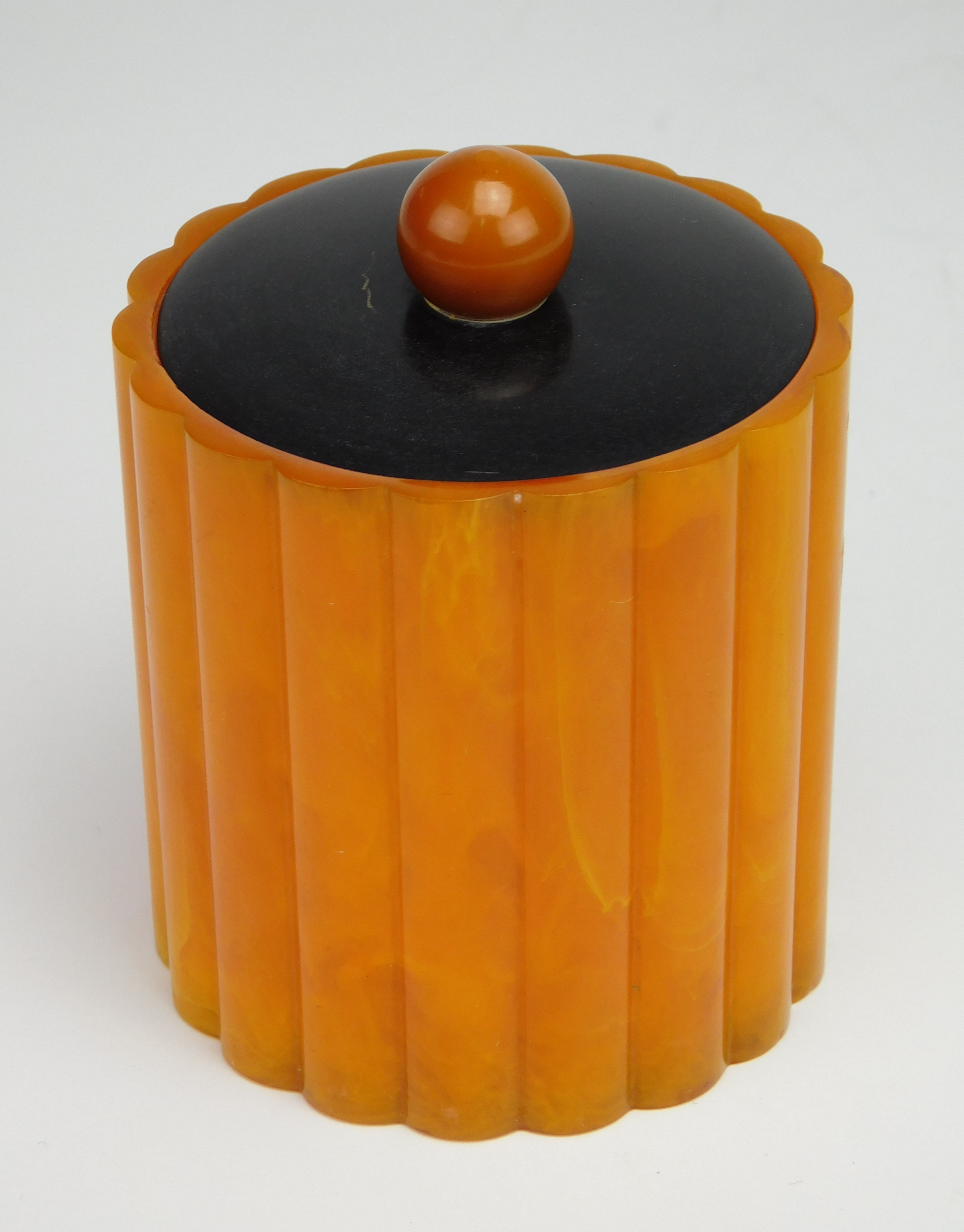 Appraisal: Bakelite Catalin round ribbed dresser box with lid ca -