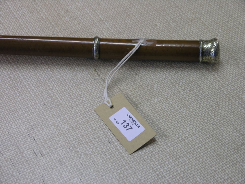 Appraisal: A late Victorian walking cane with engraved silver handle and