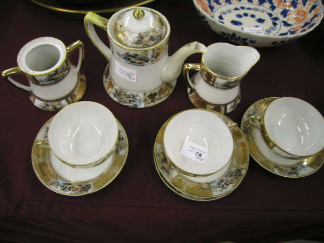 Appraisal: Nippon Handpainted Porcelain Tea Set cups saucers gold encrusted landscape