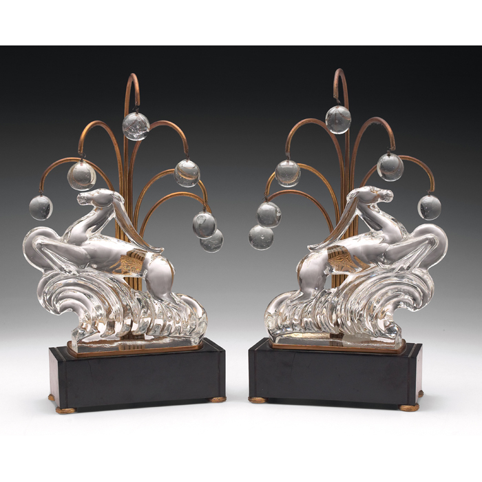 Appraisal: Steuben luminaries pair clear glass gazelle on a bakelitebase metal