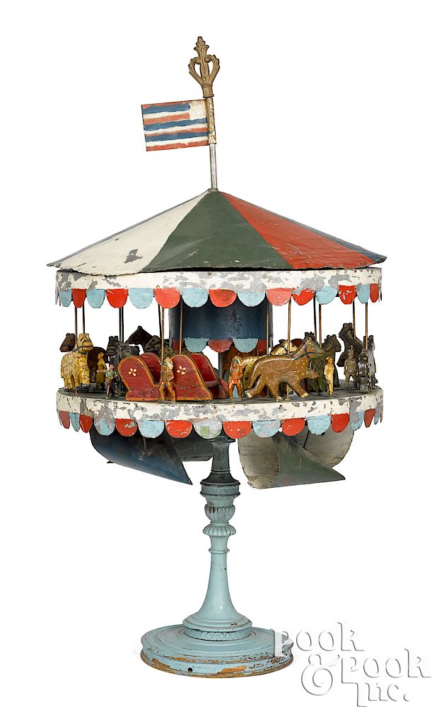 Appraisal: Tin and wood carousel wind driven toy Unique Philadelphia painted