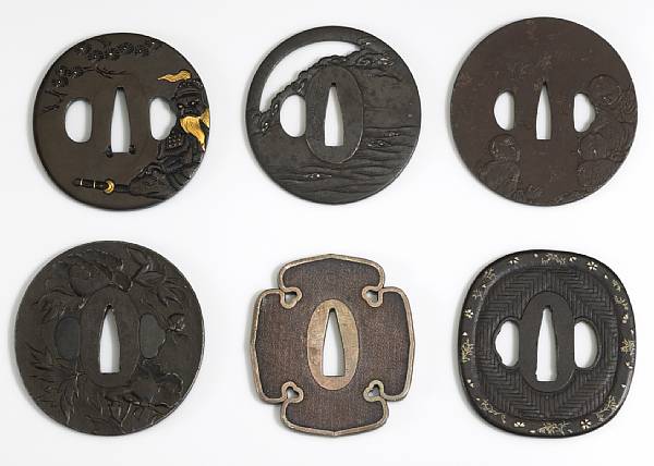 Appraisal: A gold inlaid shakudo tsuba th Century The oval plate