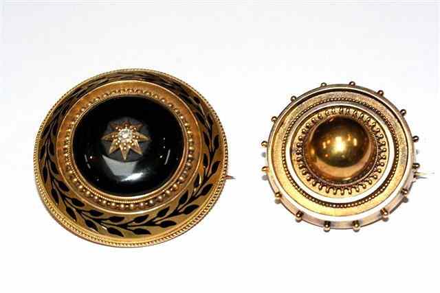 Appraisal: A VICTORIAN DIAMOND SET MOURNING BROOCH central circular black enamel