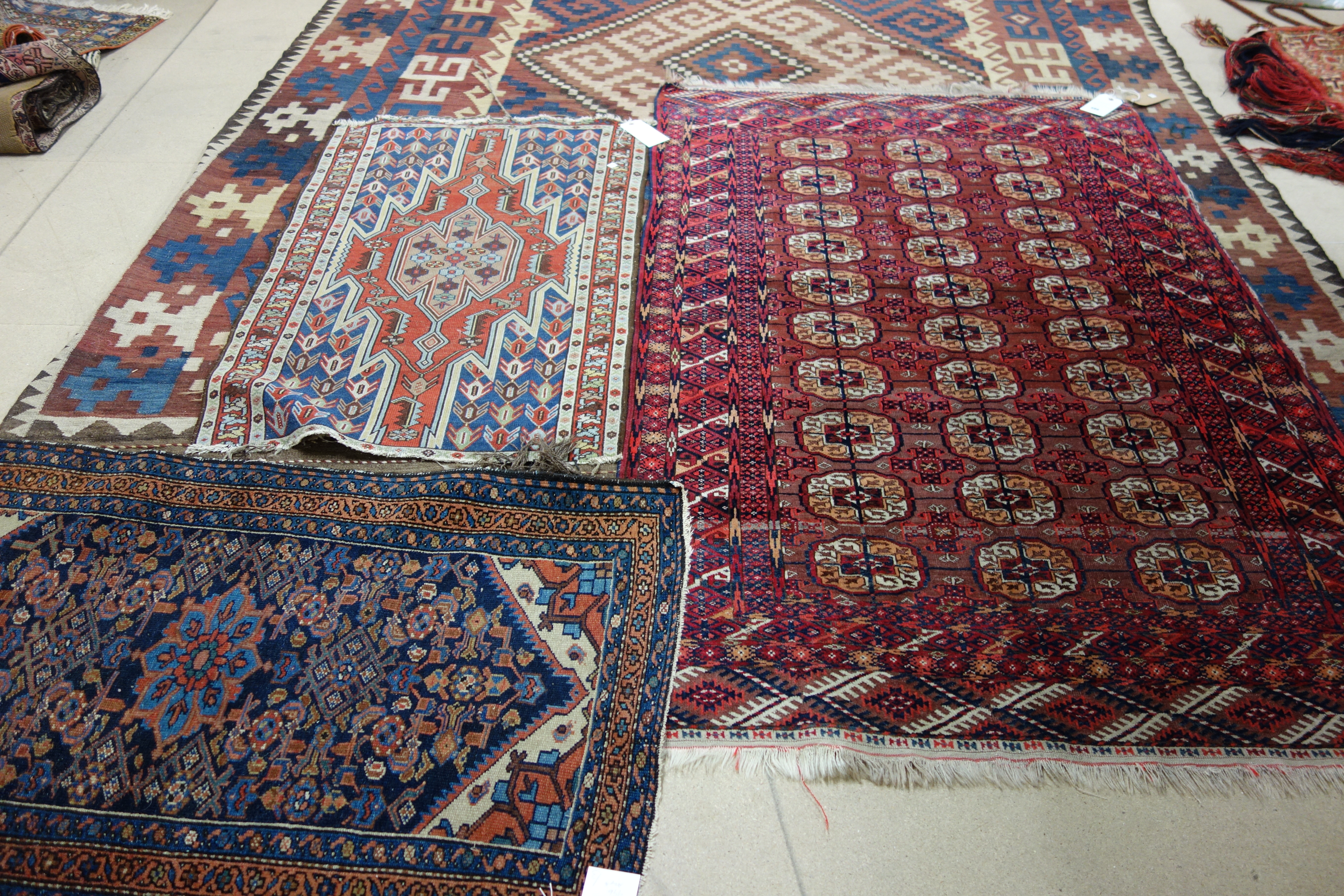 Appraisal: A Tekke Turkman rug the madder field with three columns