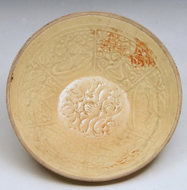 Appraisal: A CHINESE SUNG DYNASTY CREAM GLAZE CIRCULAR BOWL with foliate