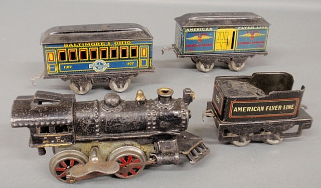 Appraisal: - Four American Flyer train cars- locomotive with clockwork mechanism