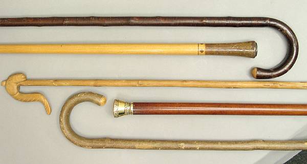 Appraisal: A gold repouss knop Malacca walking cane and four others