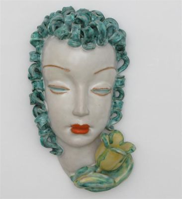 Appraisal: A Goldscheider Pottery wall mask modelled as a stylised woman