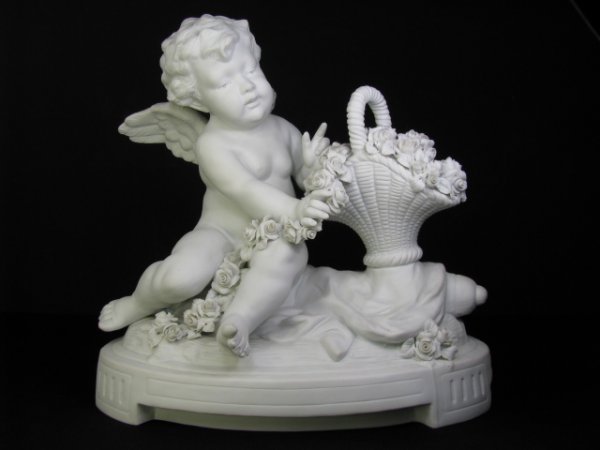 Appraisal: White bisque porcelain figural group Angel with basket of flowers