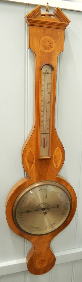 Appraisal: A thC mahogany and marquetry wheel barometer with silvered dials