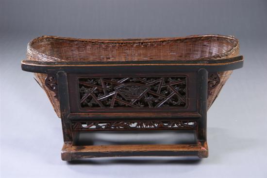 Appraisal: CHINESE WALNUT BABY CRIB AND BASKET th century With openwork