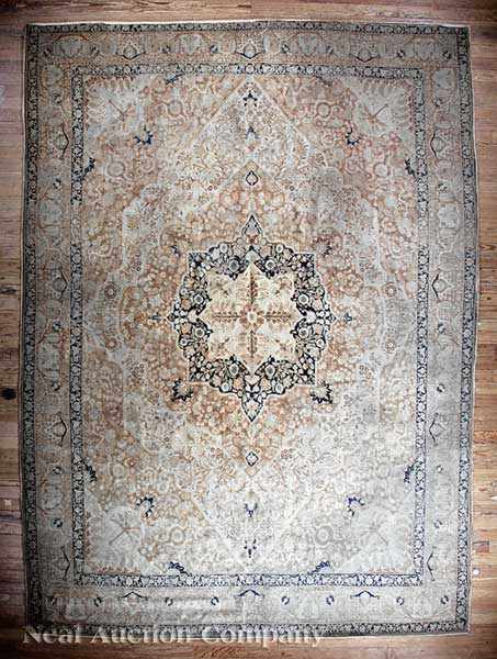 Appraisal: An Antique Tabriz Carpet cream and tan ground central geometric