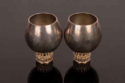 Appraisal: Stuart Devlin - a pair of silver whisky tots each