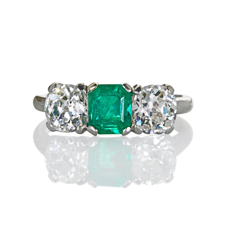 Appraisal: EMERALD AND DIAMOND PLATINUM THREE STONE RING Rectangular step cut