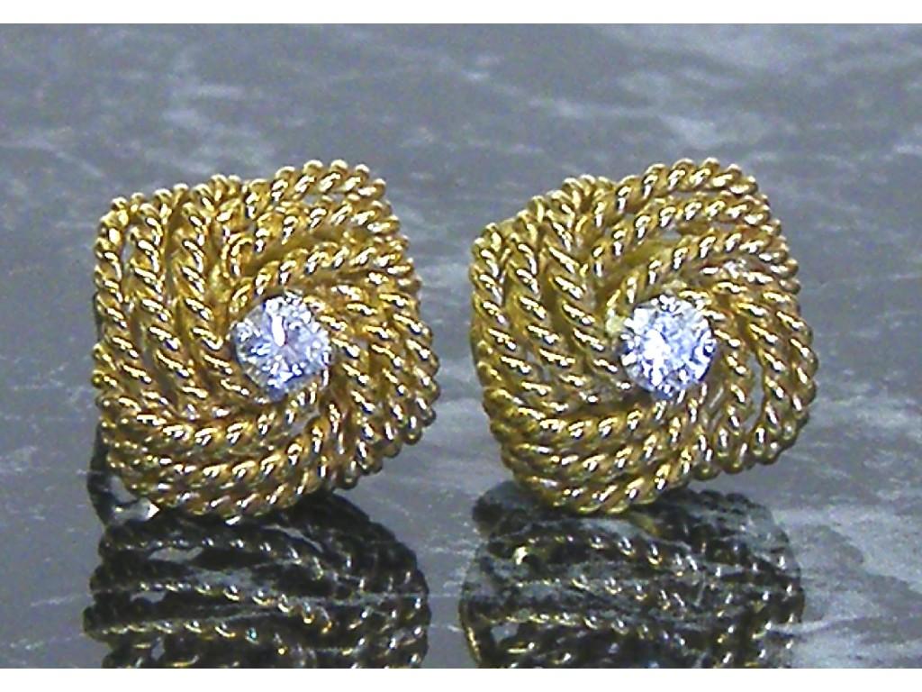 Appraisal: Pair of ct weave design earrings each with single brilliant-cut