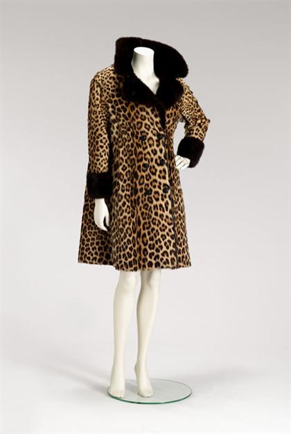 Appraisal: Leopard coat s From Victor Saks with mink cuffs and