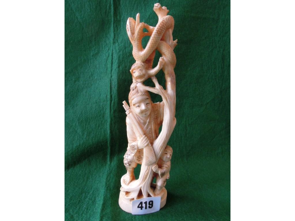 Appraisal: A Chinese ivory group huntsman and child in the tree