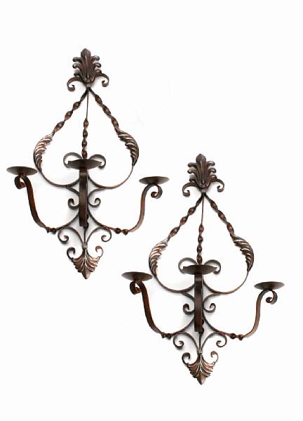 Appraisal: A pair of Baroque style wrought metal wall sconces height