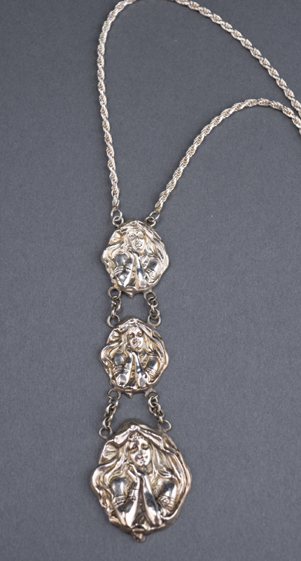 Appraisal: Sterling graduated three-face Art Nouveau pendant c